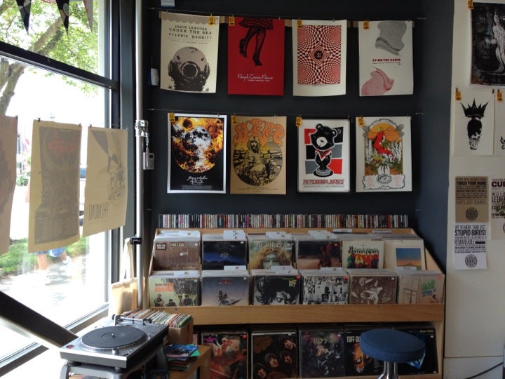 Interior of 112 PrintWorks, vinyl records and poster display